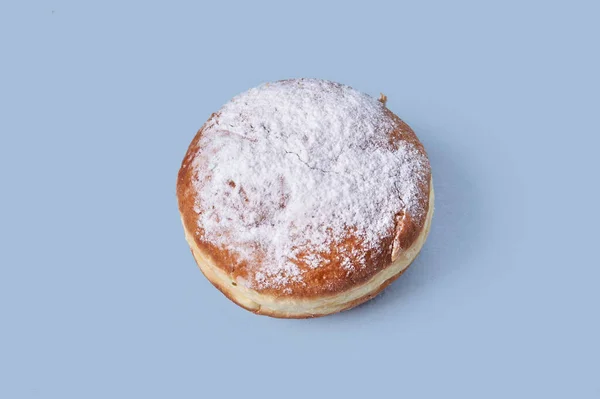 Top view of sweet pastries with filling, sprinkled with powdered sugar.