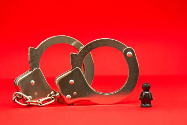 handcuffs and the arrest of a black man, antisemitism and racism, racial discrimination and violation of human rights, law and order, crime and punishment