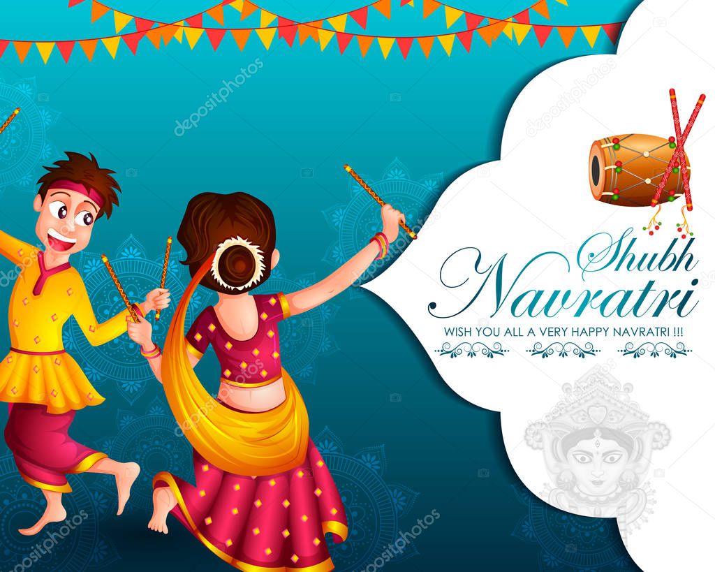 Couple performing Garba dance in Dandiya Raas for Dussehra or Navratri