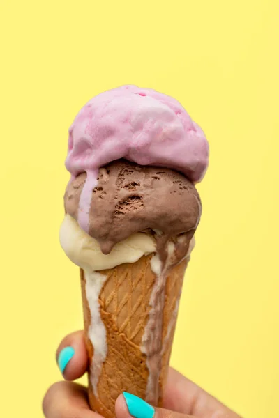 Woman Hand Holding Ice Cream Cone Melting Yellow Background — Stock Photo, Image