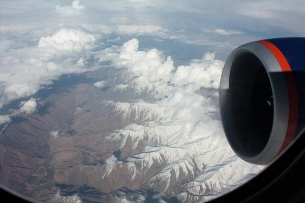 View from the plane. Airplane turbine in the window