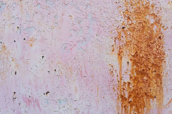 Beautiful faded pink abstract painted paper background texture with shiny metallic golden brush stroke abstract pink paint texture on rusty metal