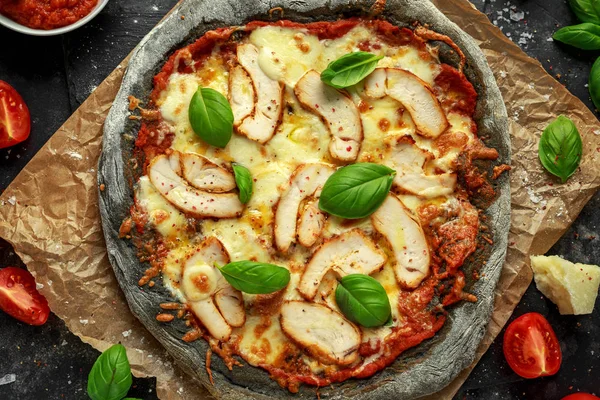 Stone Baked Black Pizza with chicken, tomato and mozzarella cheese