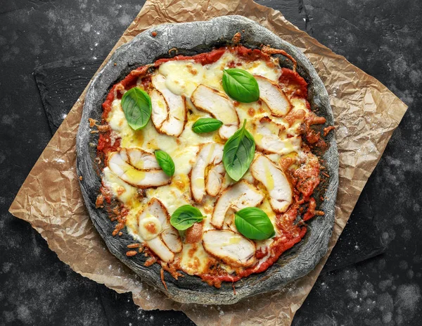 Stone Baked Black Pizza with chicken, tomato and mozzarella cheese