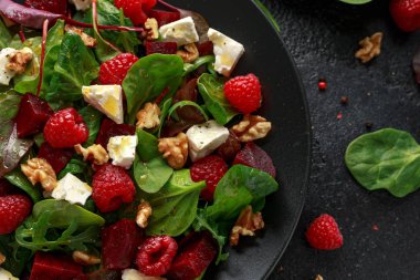 Healthy Beet Salad with raspberry, walnuts nuts and feta cheese