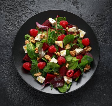 Healthy Beet Salad with raspberry, walnuts nuts and feta cheese