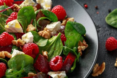 Healthy Beet Salad with raspberry, walnuts nuts and feta cheese