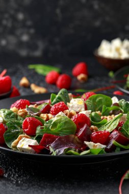 Healthy Beet Salad with raspberry, walnuts nuts and feta cheese