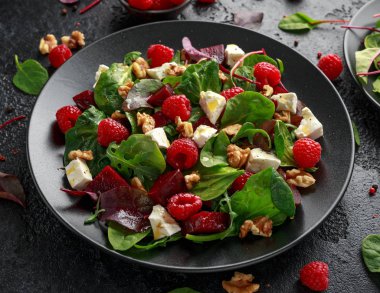 Healthy Beet Salad with raspberry, walnuts nuts and feta cheese
