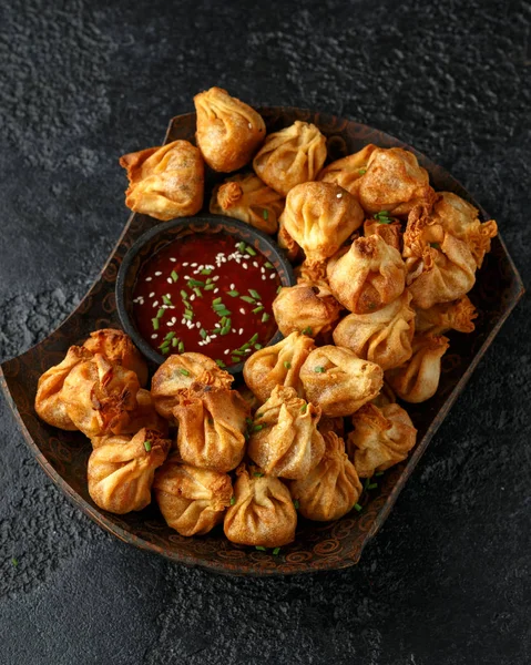 Chinese takeaway finger food Vegetable wontons with sweet chilli dip sauce