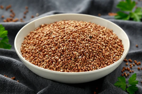 Organic roasted Buckwheat groats in white bowl. healthy vegetarian food — Stock Photo, Image