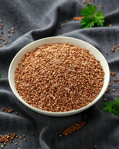 Organic roasted Buckwheat groats in white bowl. healthy vegetarian food — Stock Photo, Image