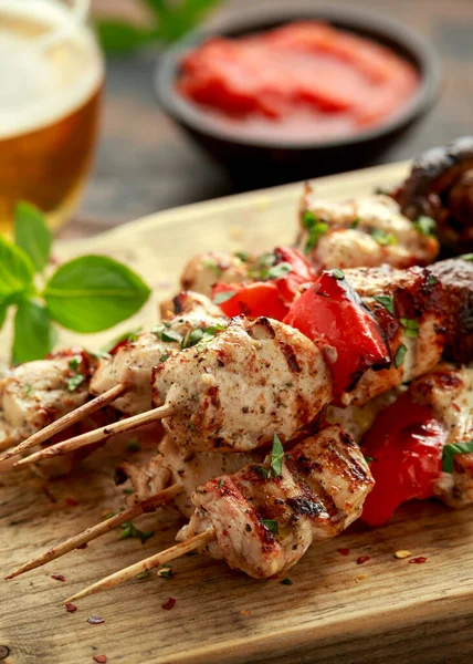 Chicken kebab, BBQ, skewers with mushrooms, red sweet pepper, zucchini and beer. Party food