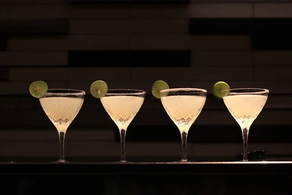 classic margarita cocktail with lime slice and salty rim