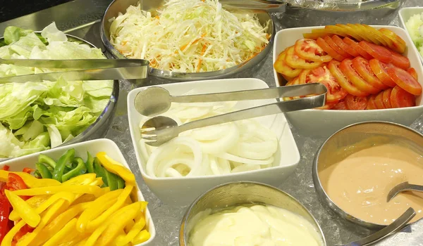 vegetables salad bar on buffet line in restaurant