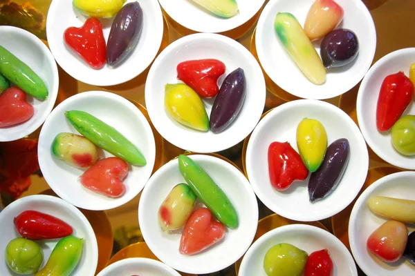 Deletable imitation fruits in small dish on buffet line — Stock Photo, Image