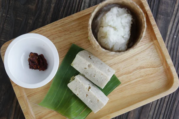 Vietnamese pork sausage with red hot chili dip and sticky rice