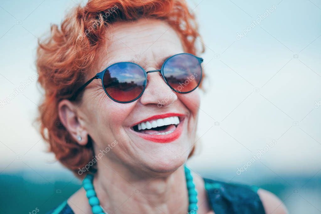 Happy mature woman enjoying life