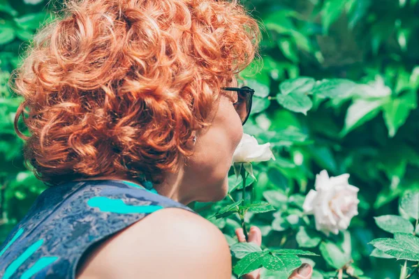 Mature Woman Smelling Rose Garden — Stock Photo, Image