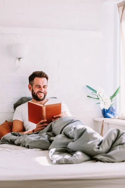 Young Man Reading Book Bed — Stock Photo, Image