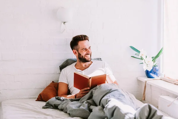 Young Man Reading Book Bed — Stock Photo, Image
