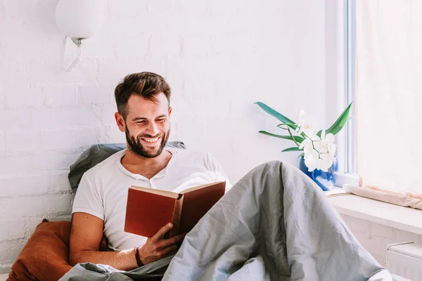 Young Man Reading Book Bed — Stock Photo, Image