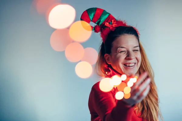 Portrait Woman Wearing Christmas Costume Holding Lights Royalty Free Stock Images