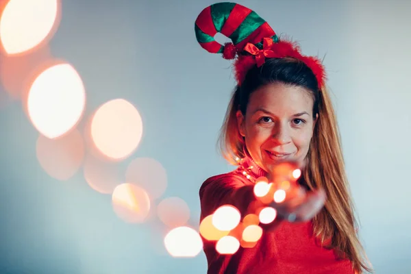 Portrait Woman Wearing Christmas Costume Holding Lights Stock Image