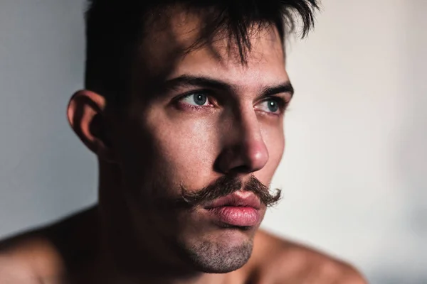 Joven Hombre Sin Camisa Con Bigote Pensando Ventana —  Fotos de Stock