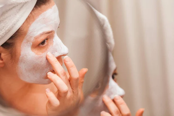 Young Woman Putting Cream Her Face — Stock Photo, Image