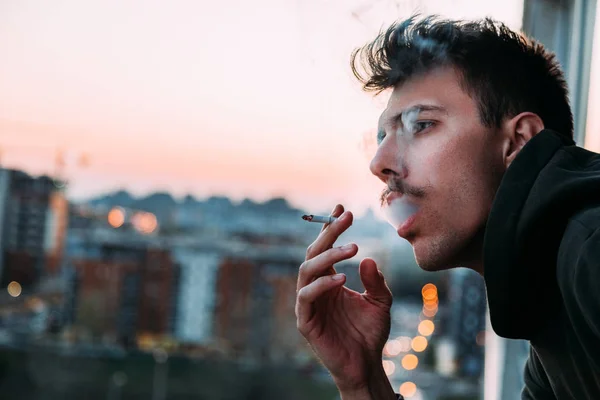 Young Man Smoking Cigarette Balcony Sunset — 스톡 사진