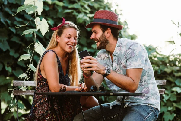 Young Couple Sitting Terrace Using Smartphone Stock Image