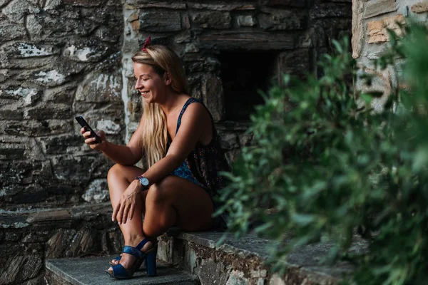 Young Woman Using Smartphone Sitting Stairs Old Village — Stock Photo, Image