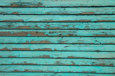 Plank blue wall  backdrop with peeling paint, heavily weathered. clipart