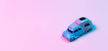 Oyuncak karavan konsepti pembe arka plana karşı neon kırmızı ve mavi ışıklarda. Boşluğu kopyala.