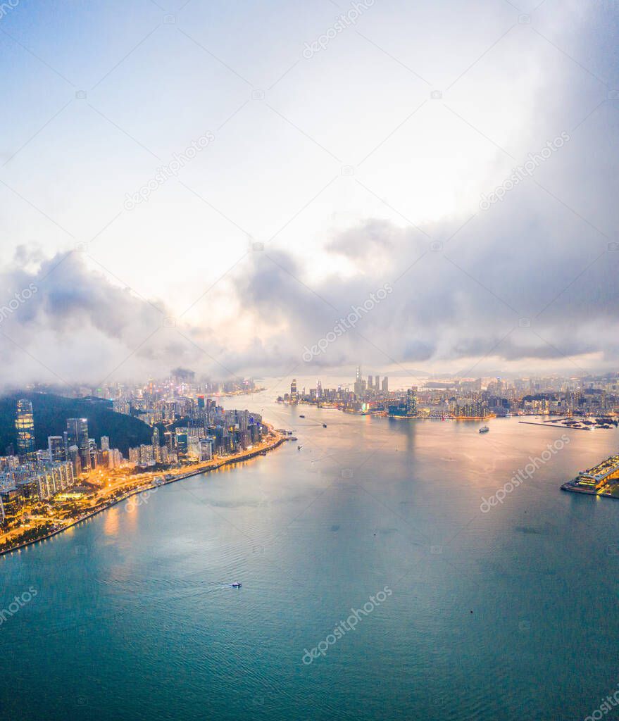 Epic Aerial view of Victoria Harbour, focus on the East side of Hong Kong Island, twilight period