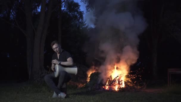 Handsome Guy Sits Fire Fairy Forest Plays Drum — Stock Video