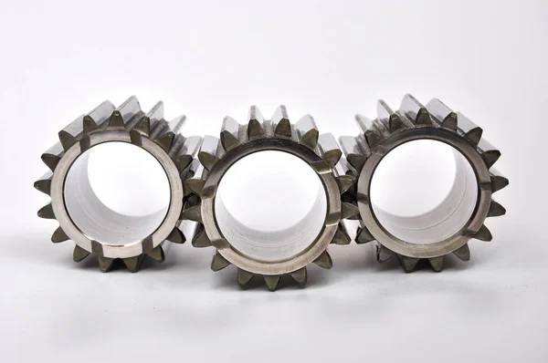 Three gears on a white background.