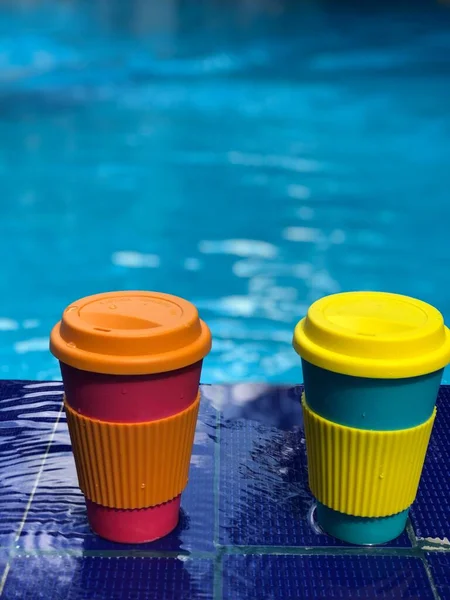 reusable bamboo mug at the swimming pool
