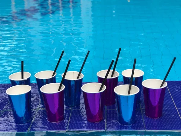 Beach background with many cocktails cups near swimming pool,Albania