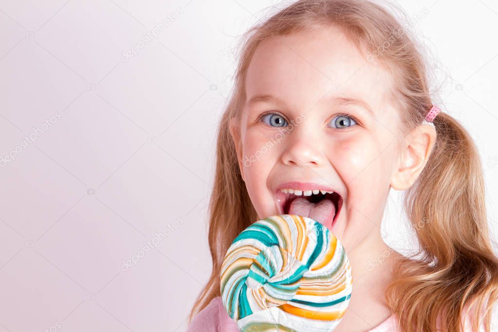 funny girl eating lollipop