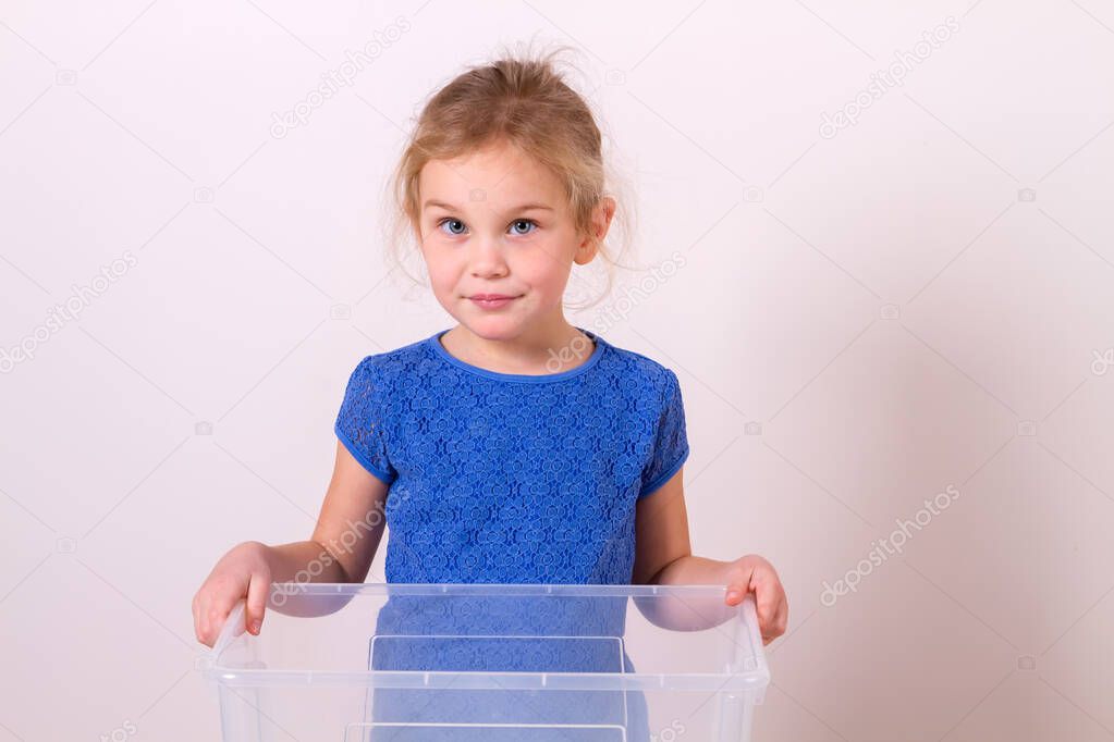 Beautiful girl holding empty box for toy on white background isolated