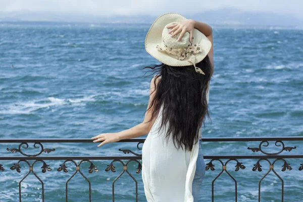 happy woman head hat in sea background