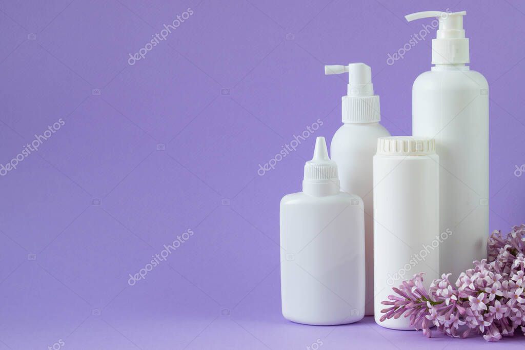 Childrens hygiene. White plastic bottle layouts. Empty space for text, quotes, sayings or logo on the background of mint.