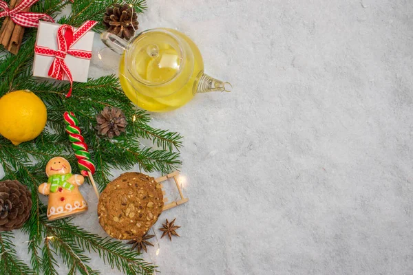 Tea with lemon. Christmas card. Prevention of colds. New year background. A festive composition. Top View Flatlay Layout