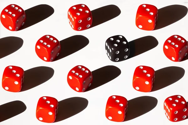 Group of red one black dices on white background with shadow isolated. Command work and leadership concept