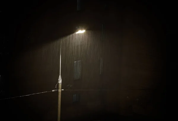 Heavy rain under Night Street lamp lights , Rainstorm