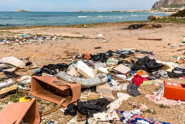 Coastal degradation with dirty beach, rubbish and domestic waste polluting the Capaci beach in province of Palermo, Sicily