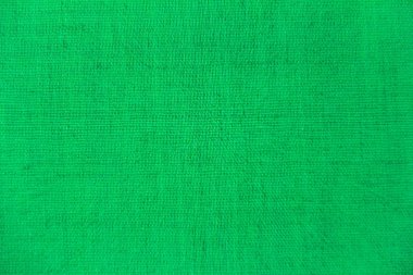Arka plan bulanıklık görünümü. Çuha kaba yün kumaş renk çim hep yeşildir. Tekstil arka plan tasarım çalışmaları için