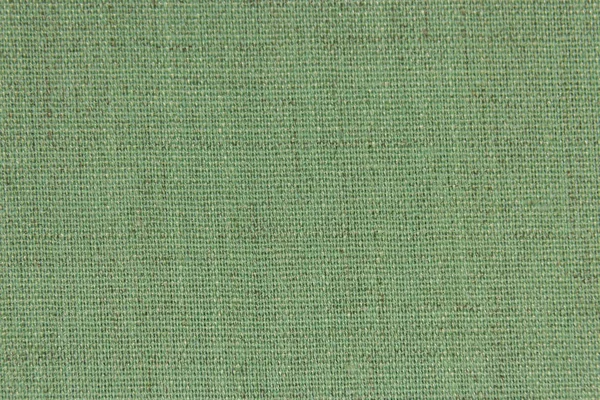 Pozadí, textura, světle zelená barva proutí textilní materiál, closeup. Struktura oliv materiál s přirozenou texturou. Fabric pozadí. — Stock fotografie